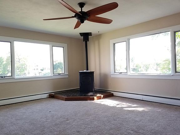 Pellet stove in bright living room overlooking Spa Creek