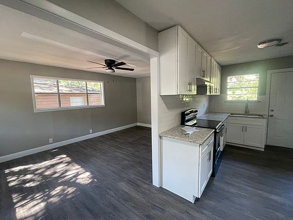 This is the view as you enter the front door. You can see their is a smooth transition from the living room to kitchen