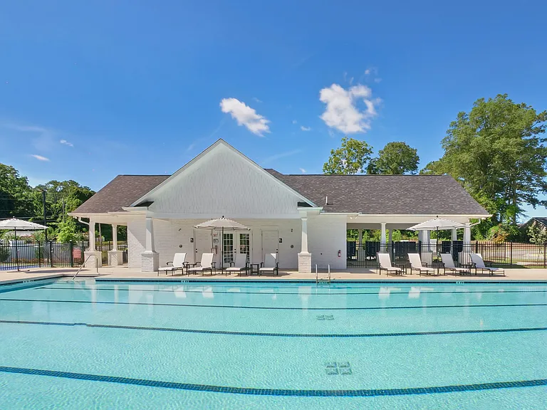 Luxurious poolside retreat with elegant seating.