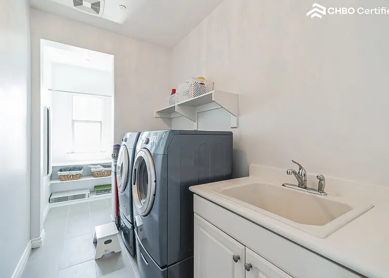 second floor Laundry Room with washer/dryer and deep sink