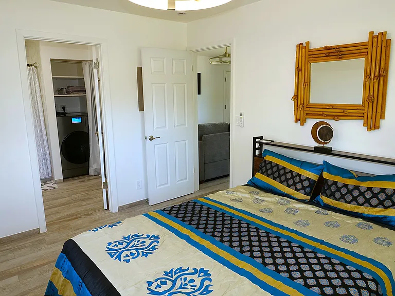 Spacious bedroom with furnished full size queen