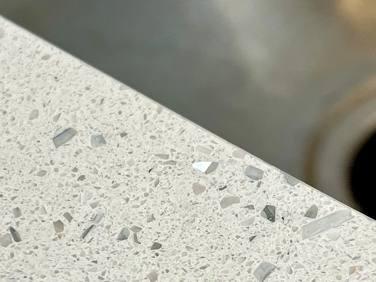 Quarts countertop sink detail showing the sparkles distributed throughout.