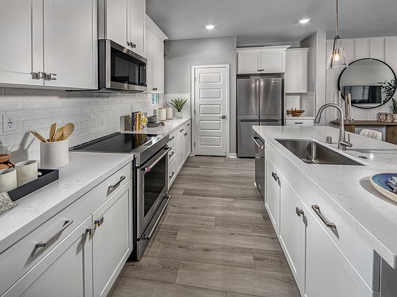 Kitchen in the 2135 floorplan at a Meritage Homes community in San Pedro, CA.