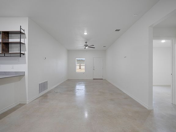 A welcoming entryway that opens directly into the bright, open-concept living room.