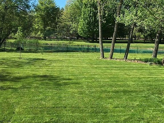 This home has a deep, fully fenced backyard that backs up to a pond and gorgeous tree line.