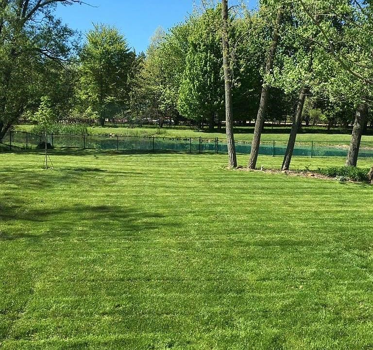 This home has a deep, fully fenced backyard that backs up to a pond and gorgeous tree line.