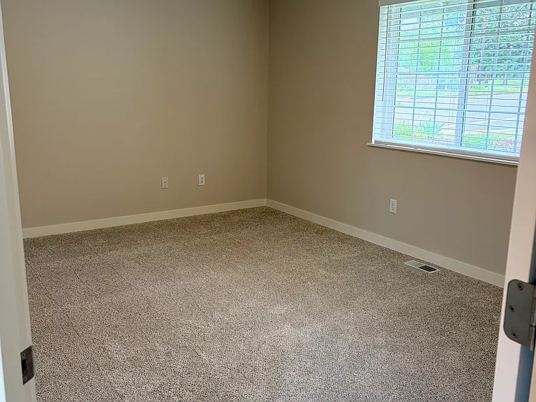 Great primary bedroom space. Huge window for plenty of light. Private entrance to main bath and walk-in closet all your own!