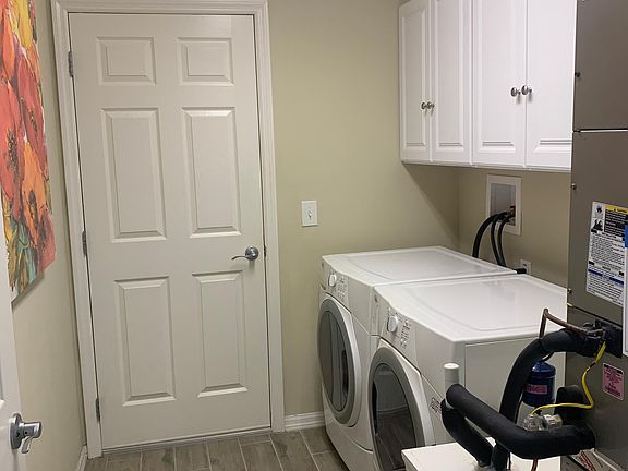 Laundry room with front load washer and dryer.