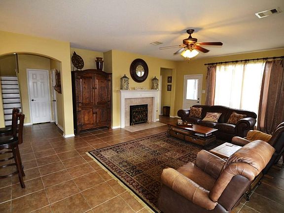 Den with a recessed media niche, extended tile, natural light, upgraded fan, gas fireplace.....back 