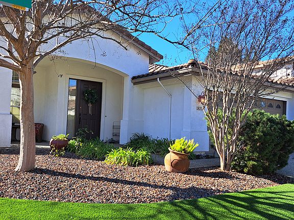 Immaculate front and back yard landscaping maintained by gardener paid by owner.