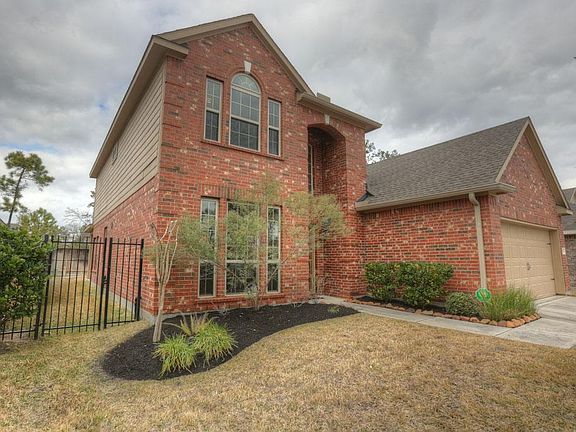 Gorgeous brick facade, spacious 2 car garage, extensive front yard landscaping and iron gate all say