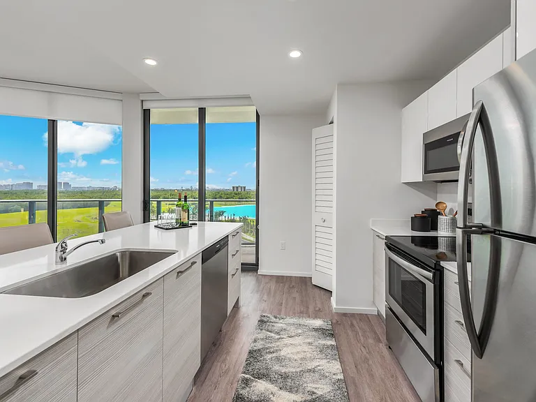 Kitchens are outfitted in modern stainless steel appliances