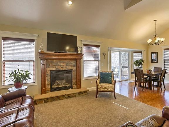 Living room w/ stunning stone gas FP