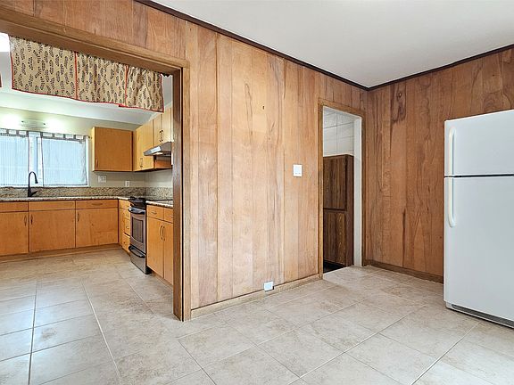 Kitchen, Laundry Room Entrance, Dining Room (extra fridge can be stored in garage)