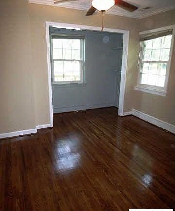 fresh paint and refinished hardwoods in master bedroom