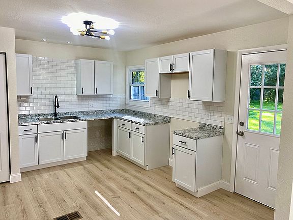 Kitchen w/ door to backyard