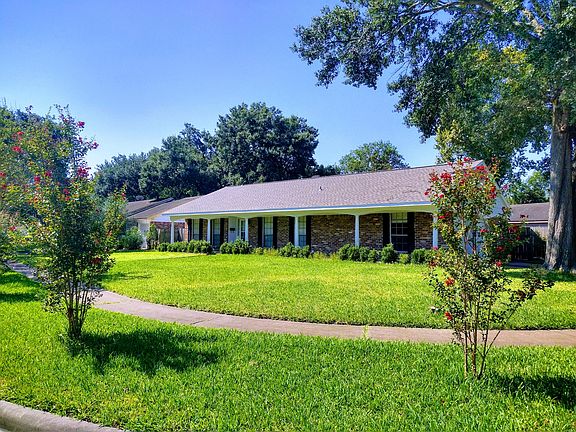 Wonderful curb appeal with petite and mature trees in front yard.