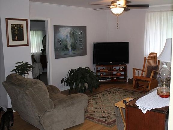 Spacious living room with laminate wood flooring