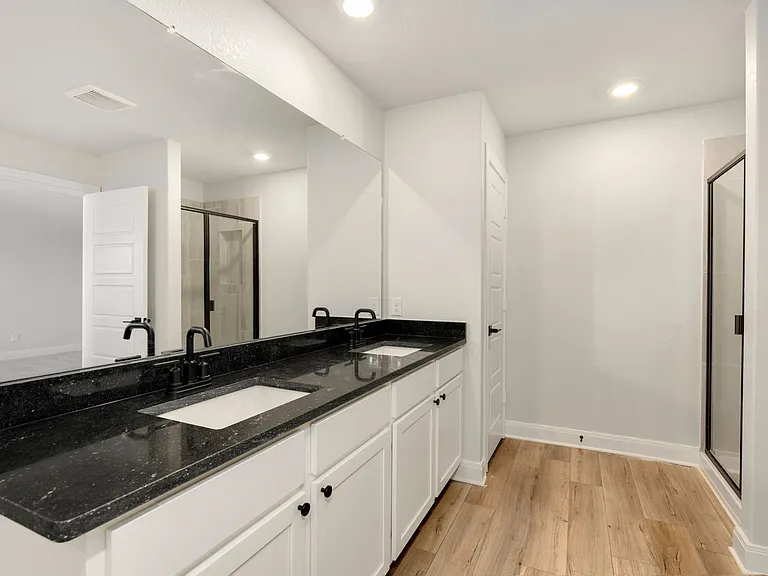 A dual sink vanity in the master bathroom.