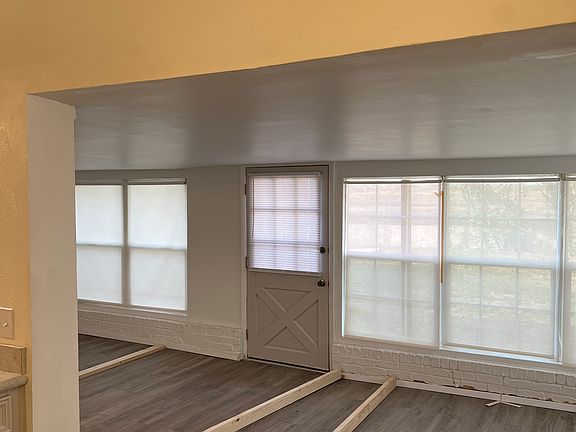 Sun Room off the kitchen. Airy and beautiful! 

Note - Boards down attaching base trim. Will be removed soon.