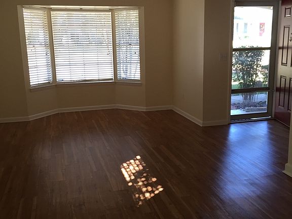 Entry way leads into very large front living area with bay w