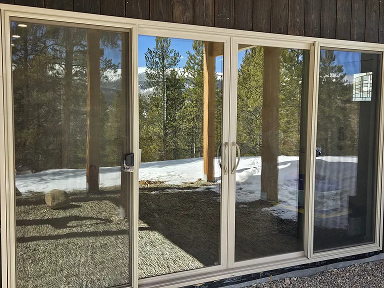 Floor-to-ceiling glass doors for expansive views from the great room