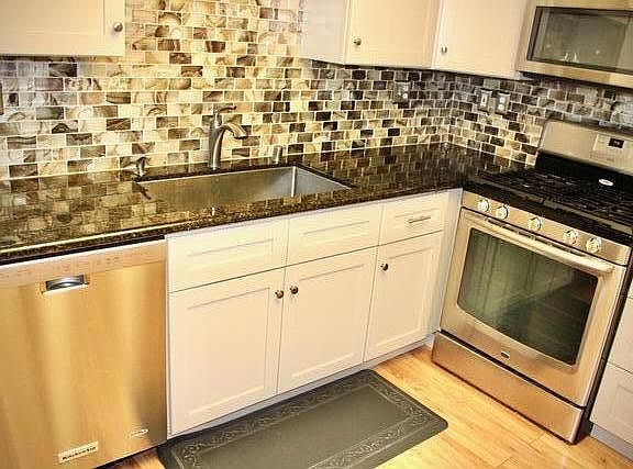 Remodeled kitchen with granite counter tops, stainless steel appliances (refrigerator not included).