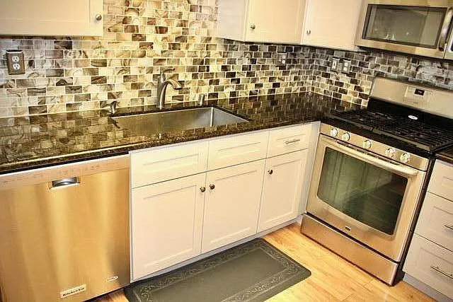 Remodeled kitchen with granite counter tops, stainless steel appliances (refrigerator not included).