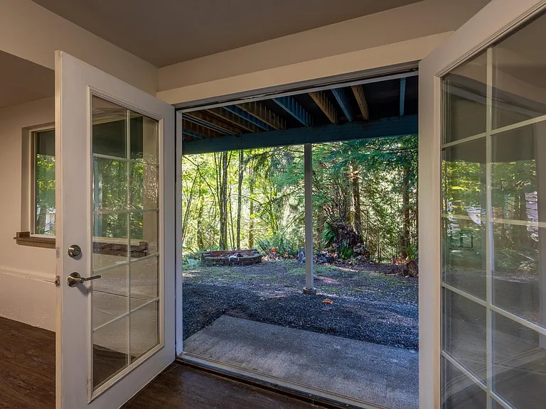 Lower level with french doors to the private backyard