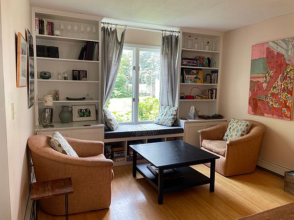 sitting area near open dining room and kitchen