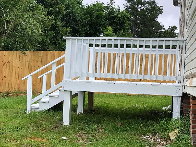 Deck on the back. Corner lot with fence between you and the neighbors