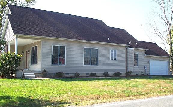 Situated on a corner lot on just under an acre