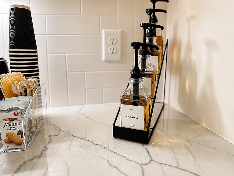 Start your morning right and save the Starbucks money, with your very own custom espresso and beverage bar with wine fridge, syrups, tea, honey, snacks and glassware for elevated mornings and nights in.