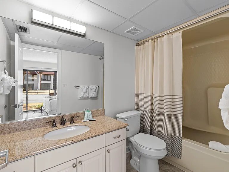 King Guest Bathroom has a vanity, and tub/shower combo