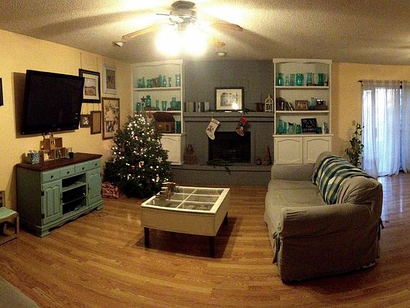 wide angle view of living room and dining room