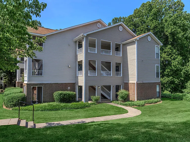 Well-Maintained Building Exterior with Spacious Lawn Area