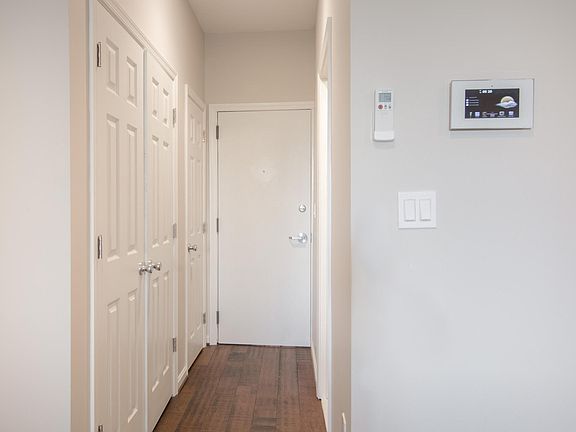 Apartment entrance hallway. Intercom system and HVAC remote 