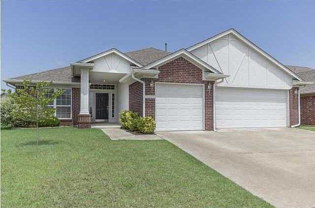 Front view, 3 car garage with storm shelter