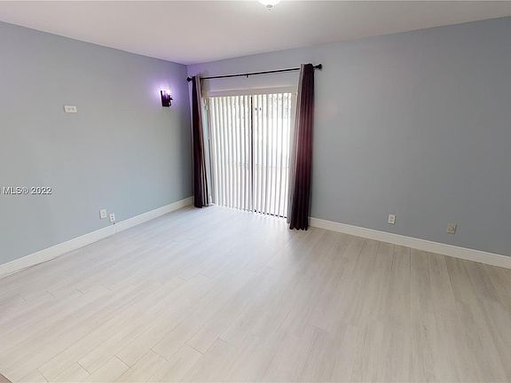 Master bedroom opens to lovely tiled patio.
