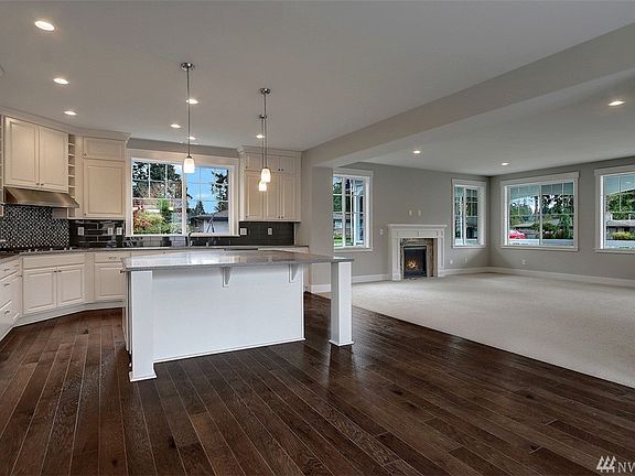 Kitchen and Family Room.  Photo not of actual home and may include options.