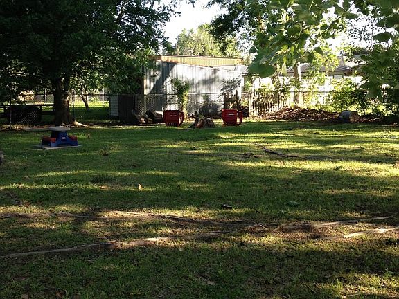 Large fenced and shaded back yard