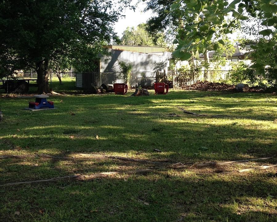 Large fenced and shaded back yard