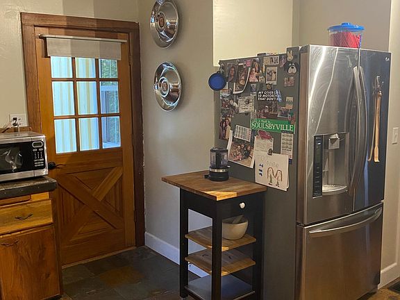 Door to small porch, off kitchen