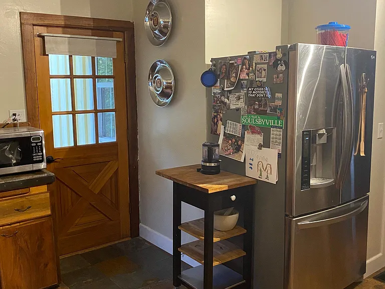 Door to small porch, off kitchen