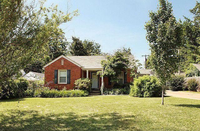 Midtown brick bungalow with mature trees