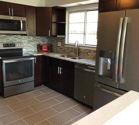 Cherry Cabinets & Slab Granite Counters