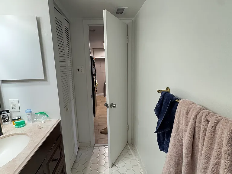 Bathroom door that opens towards hallways