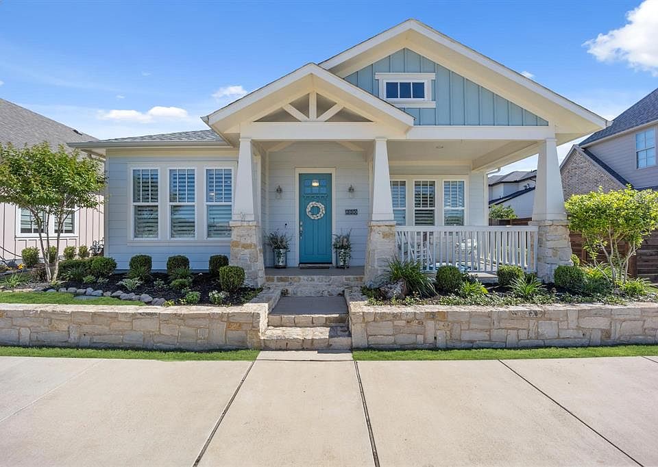 Cottage style with stone accents.