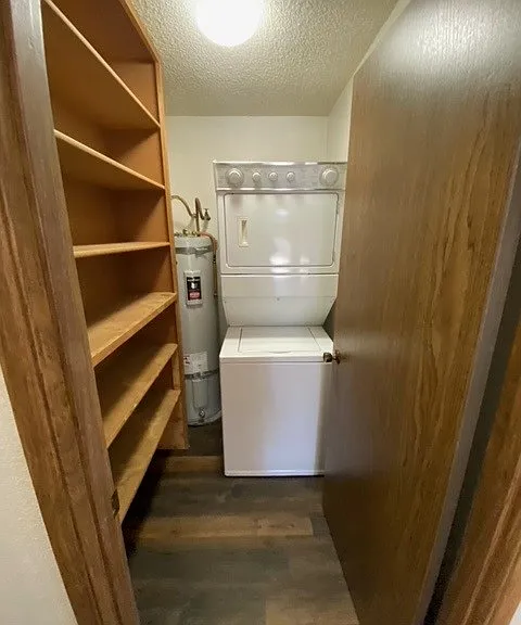 Laundry Room - Stackable W/D in unit - laundry room features plenty of shelving for additional storage.