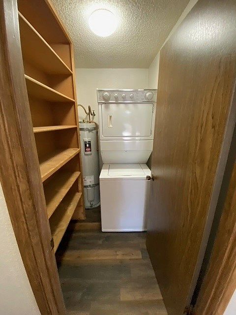 Laundry Room - Stackable W/D in unit - laundry room features plenty of shelving for additional storage.